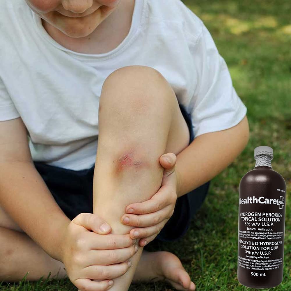 The picture depicts a child with a bruised knee, and within the same image, there is a picture of a Healthcare Plus® Hydrogen Peroxide Topical Solution bottle.