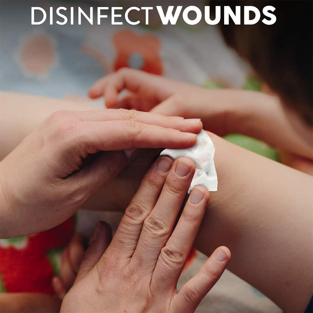 A woman cleaning a child's disinfect wound with Stevens Alcohol Prep Pads